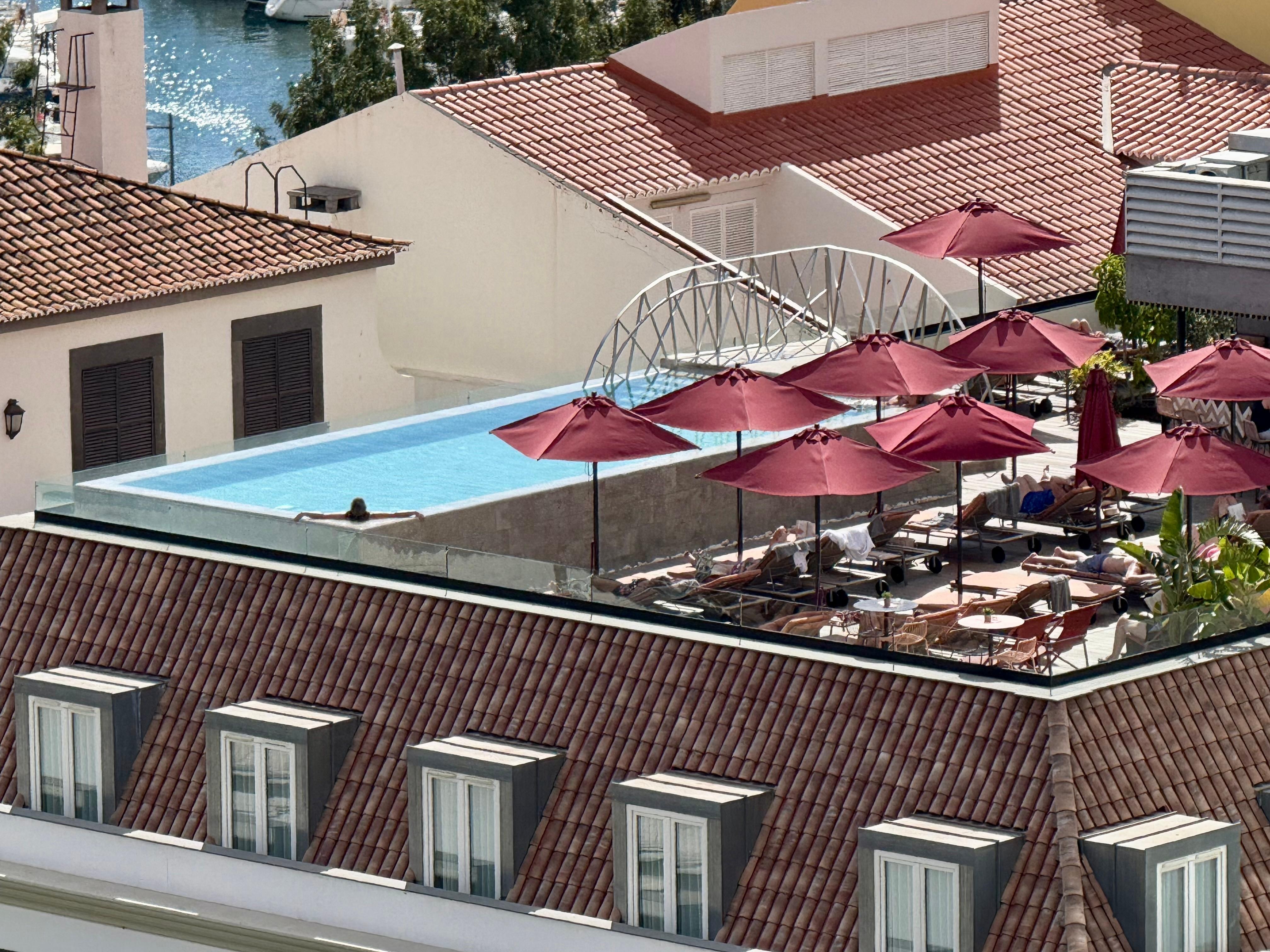 Chilling in my favourite corner while my husband climbs the clock tower across the street