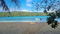 The beach with in front the Japanese gardens