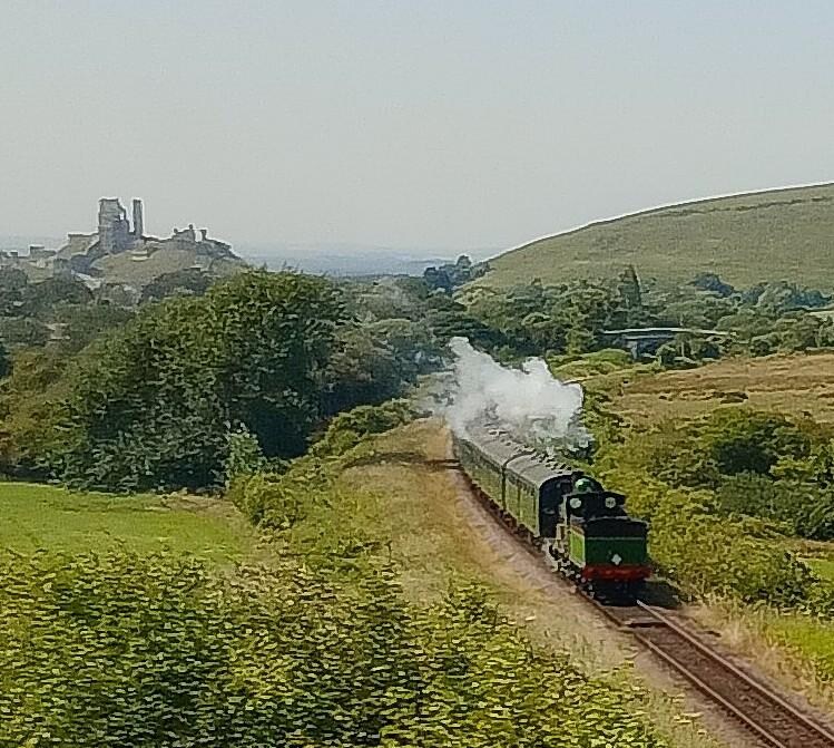 Approaching Corfe Castle, on my way, however a lovely day's excursion is to catch the Breezer 30 to Corfe, Steam train from Corfe to Swanage and the Breezer 30 back to Weymouth 

