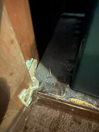 Inside cabinet where refrigerator is located. 2nd room