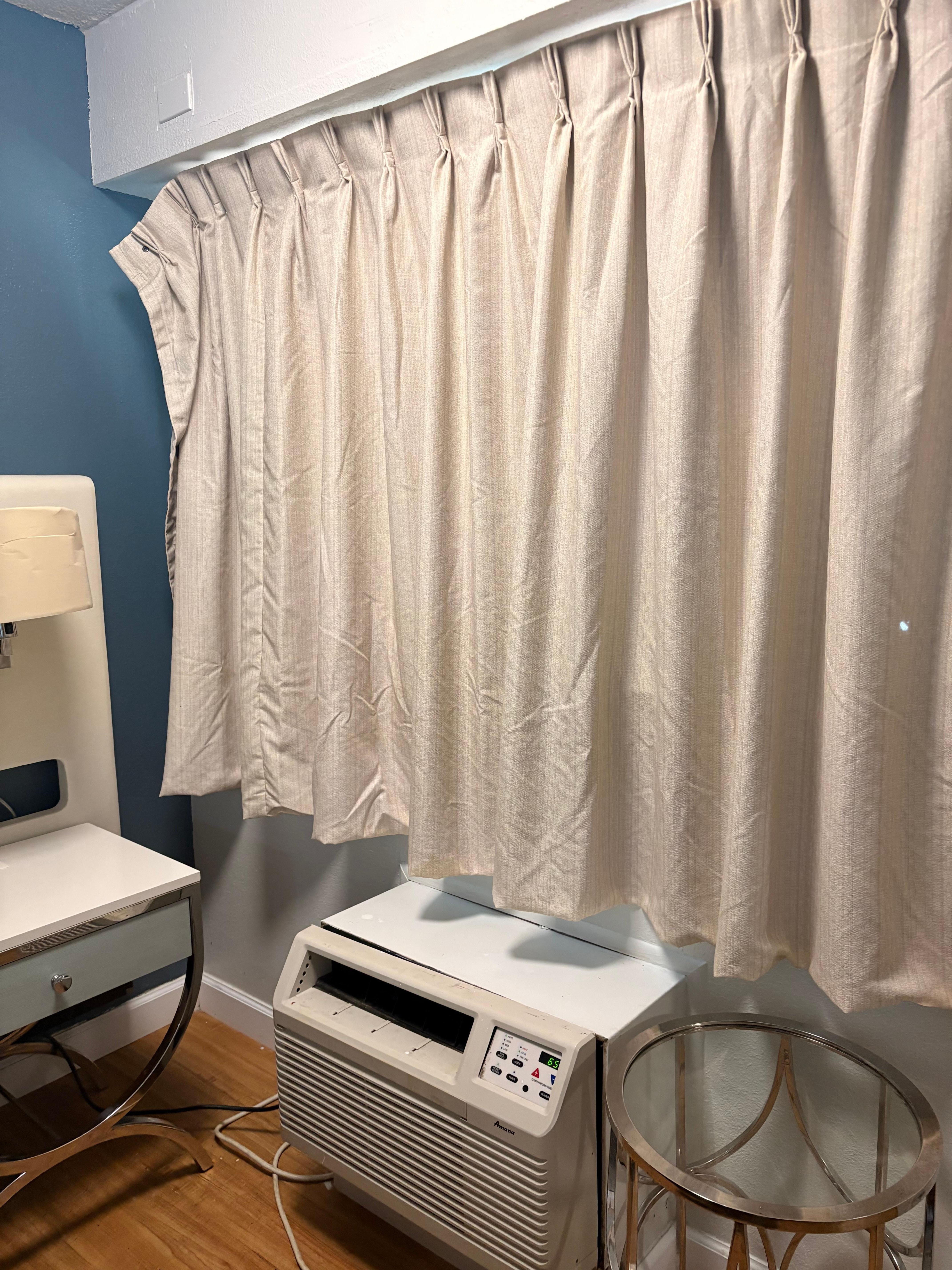 Curtains barely hanging on and have hole