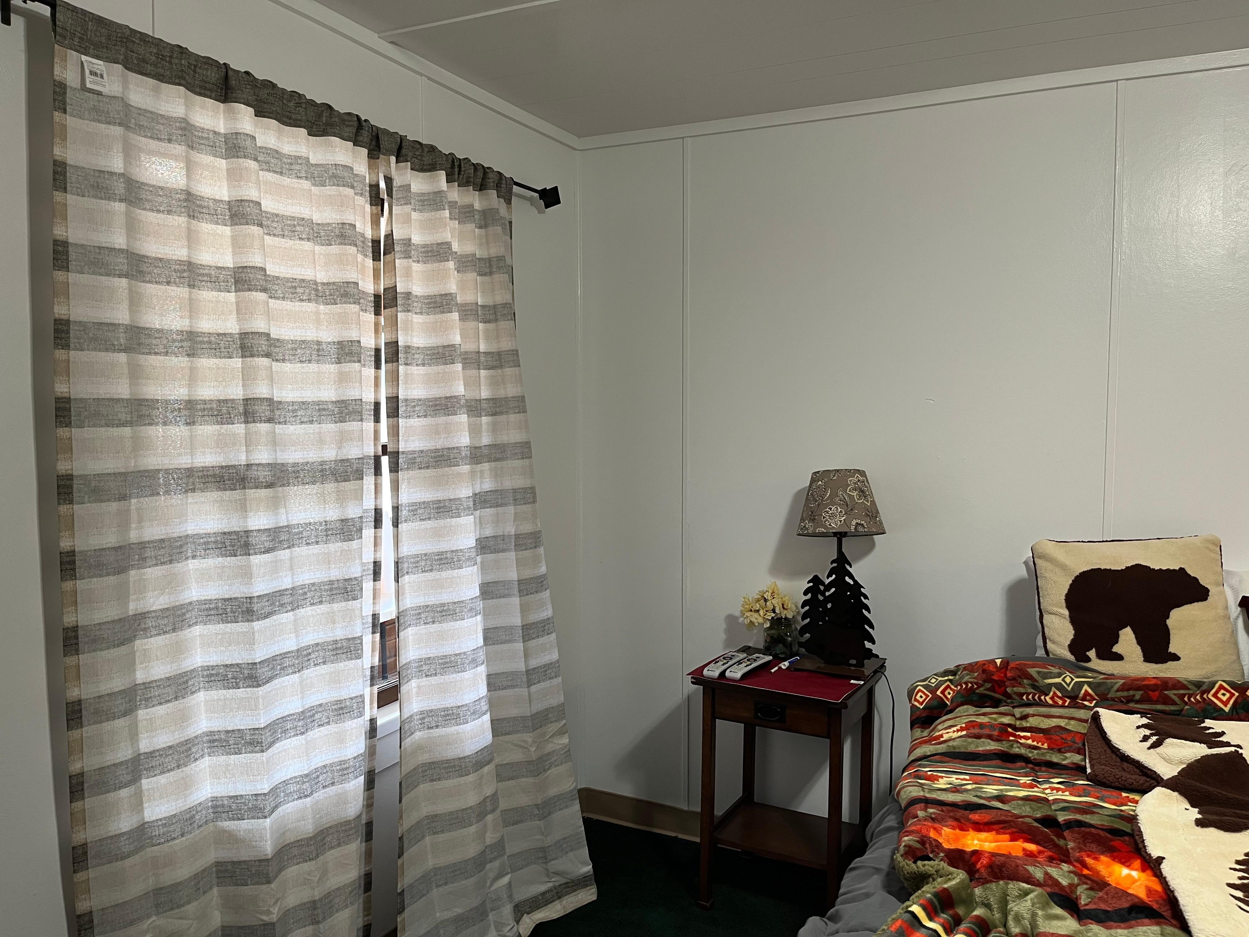 Thin curtains over a window that opened to the corridor of the property (rather than to outside). Walls were thin.