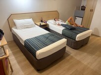 2 adults , can’t even push beds together, not like any pics in the description