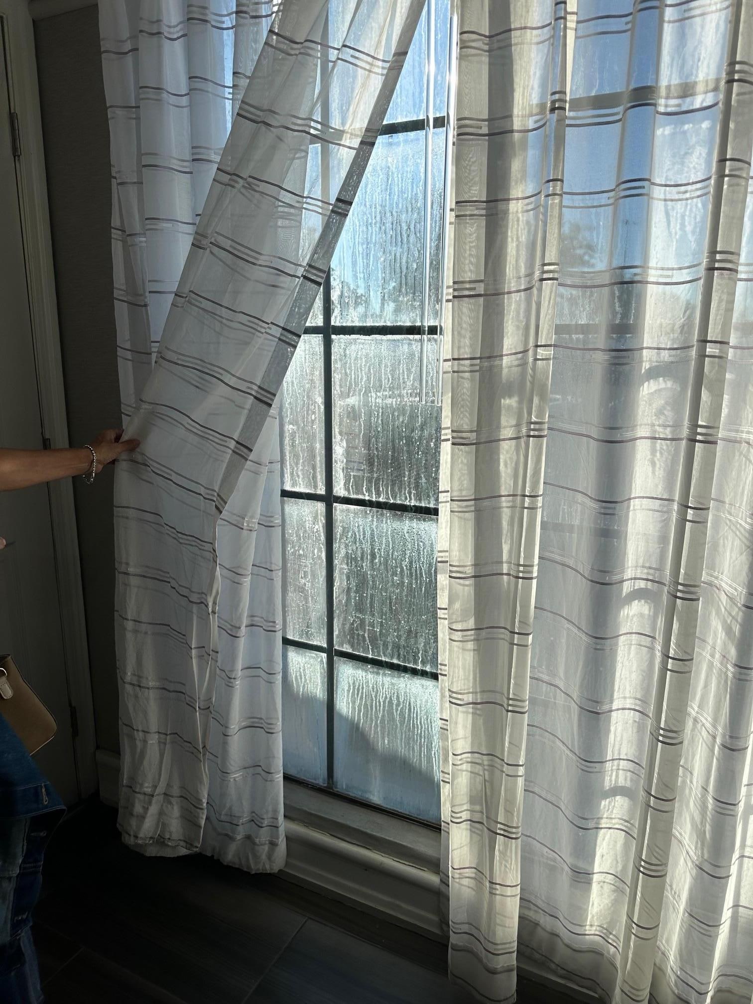 Dirty Window in Hallway