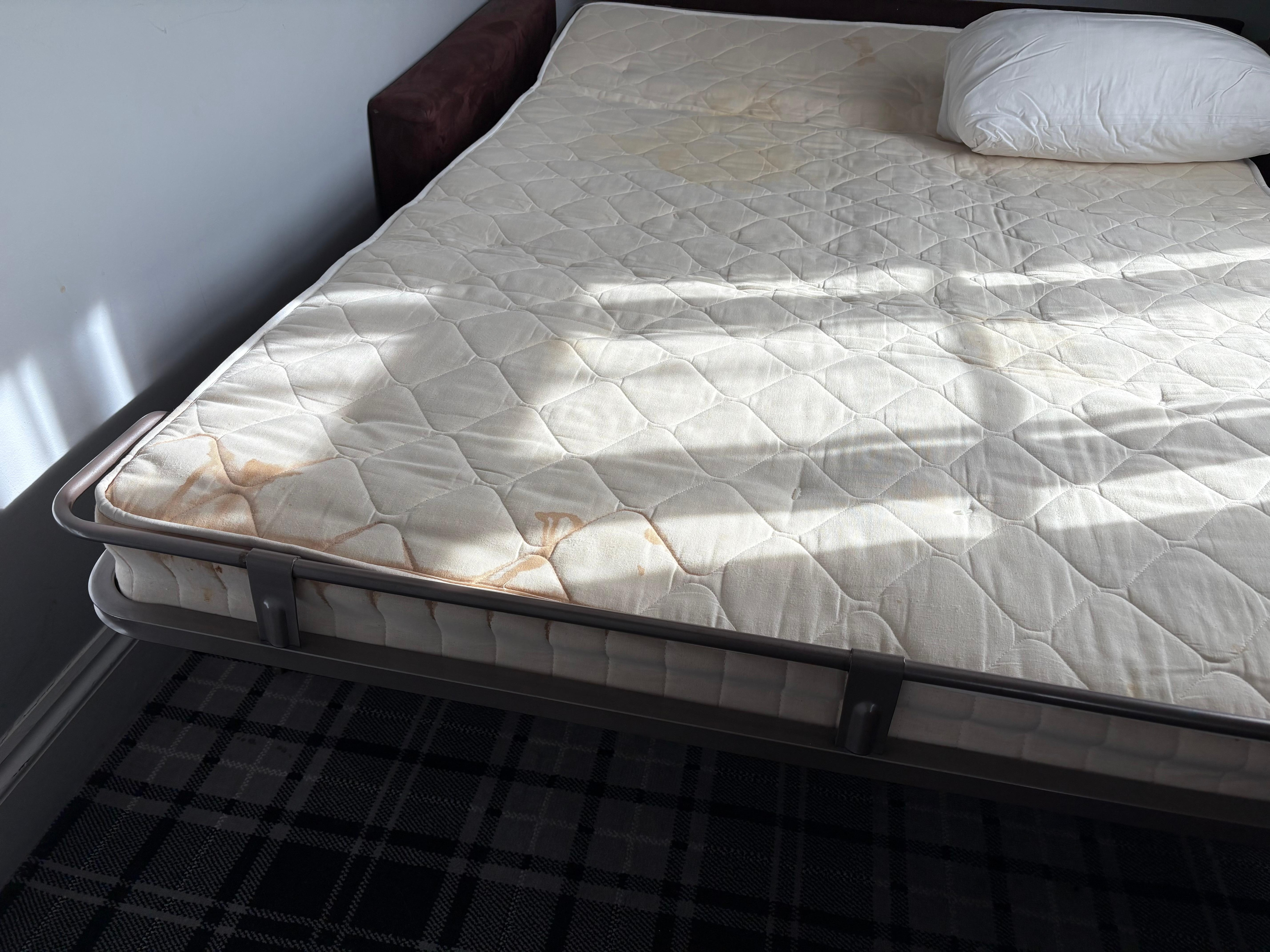Heavily stained mattress.