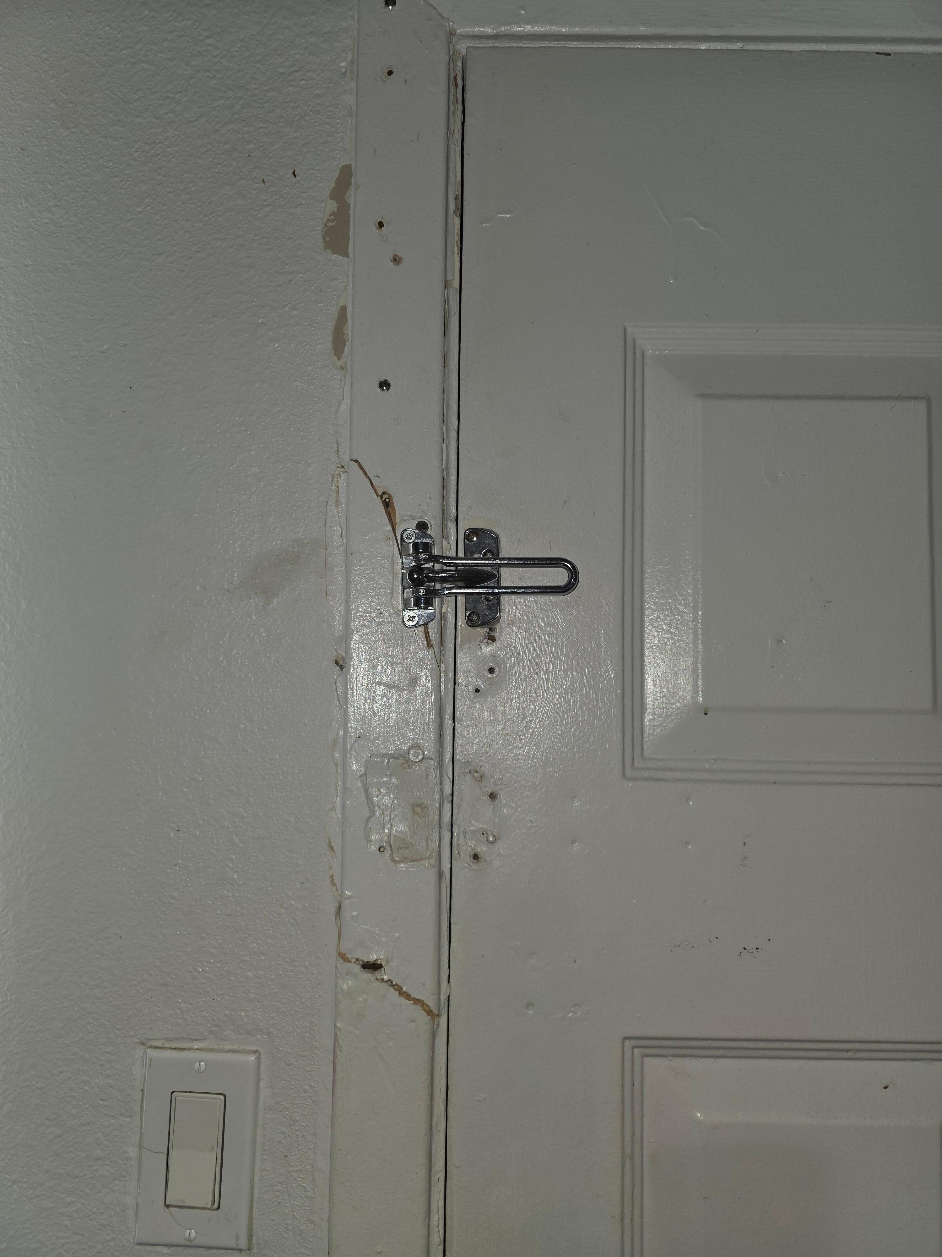 Someone kicked in the door. Shoddy repair. Not secure at all