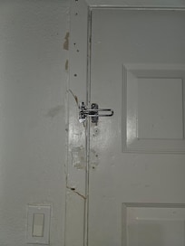 Someone kicked in the door. Shoddy repair. Not secure at all