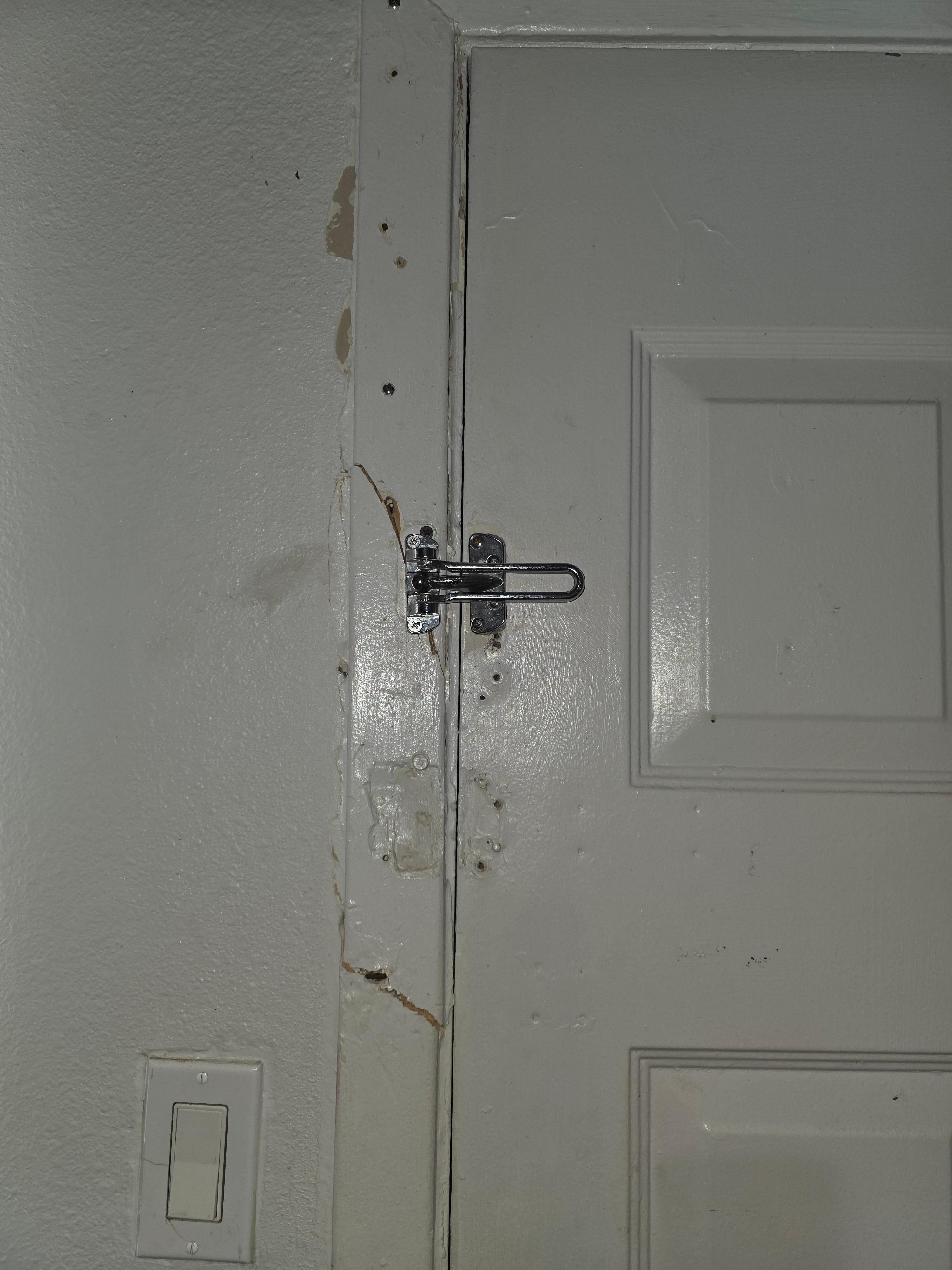 Someone kicked in the door. Shoddy repair. Not secure at all
