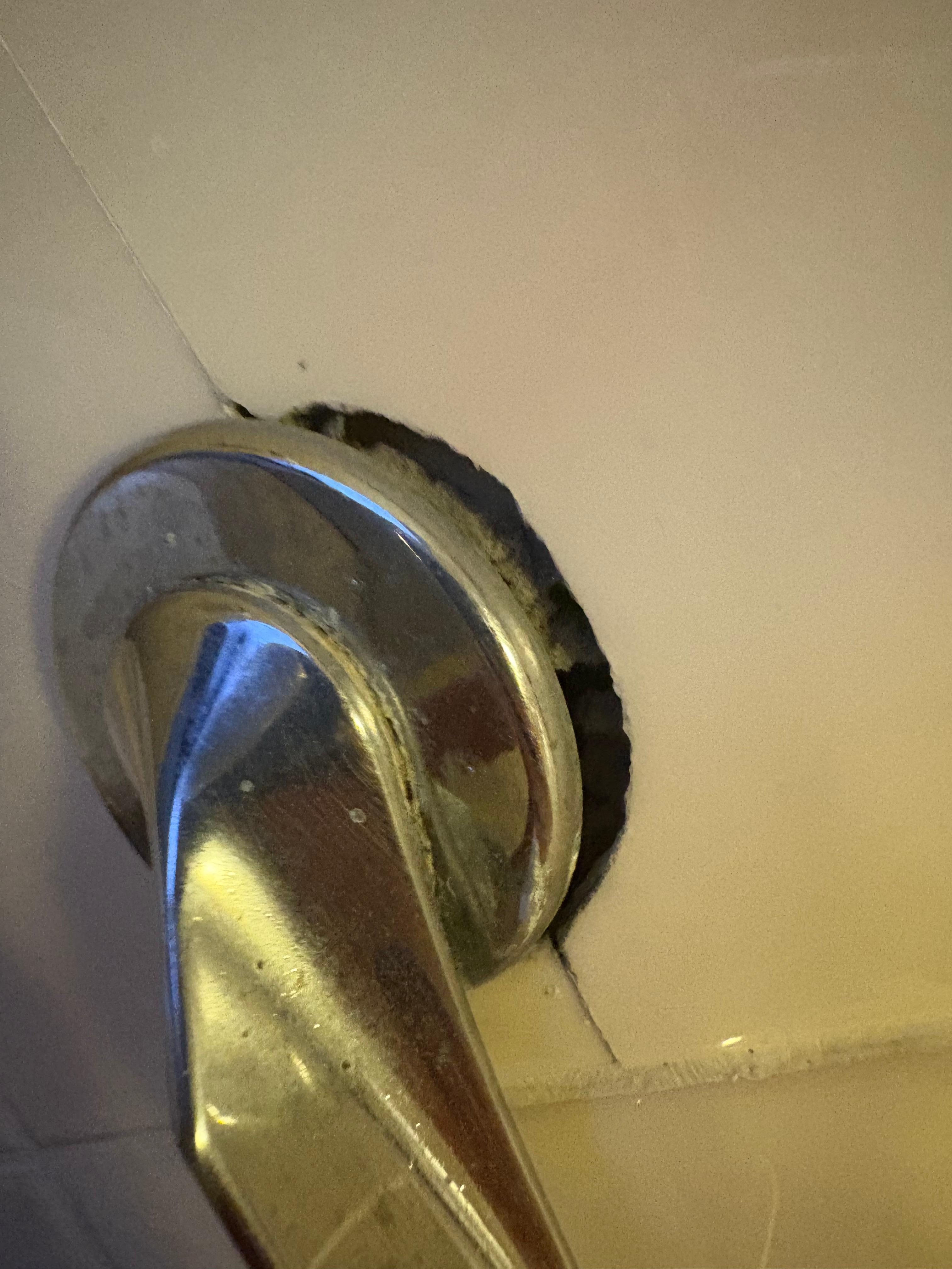 Toilet handle hanging off