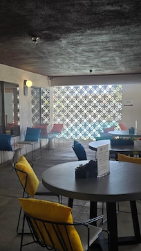 Communal sitting area near gym, pool and vending machine