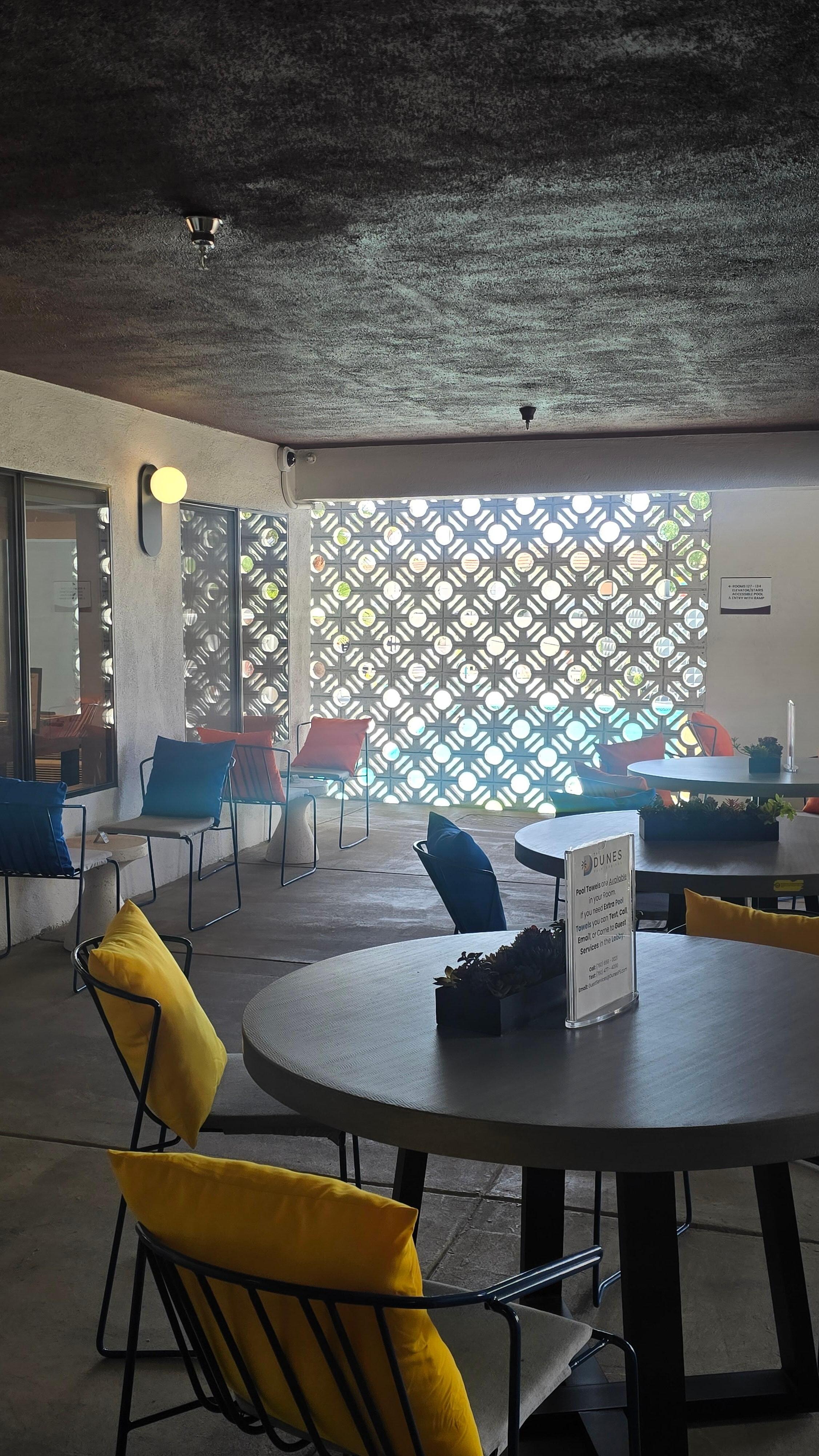 Communal sitting area near gym, pool and vending machine 