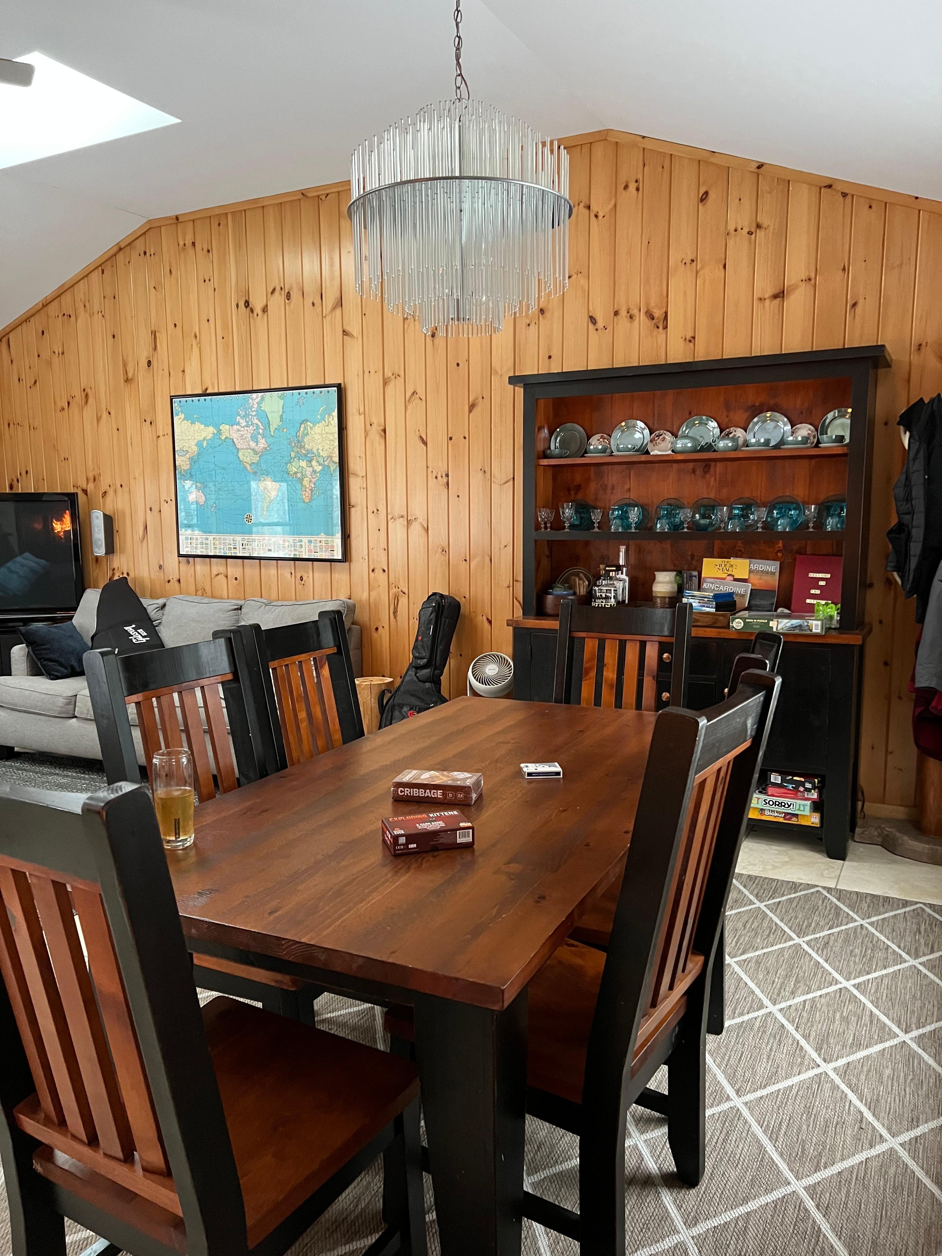 Large dining room table as well as picnic table by sliding doors. 
