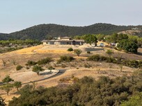 This is a photo of a huge home on the hill behind the house.