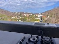 rooftop kitchen... no gas line to cooktop.
cold water only at sink
BBQ is briquet only