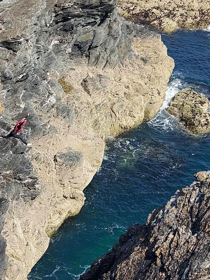 15 year old leaping into sea during Coasteering with Andy Williams
