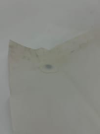 Dirty shower curtain with mold at bottom