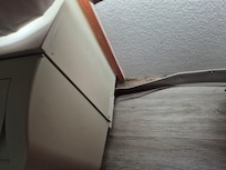 Wall molding next to a/c unit coming loose and attempted repairing