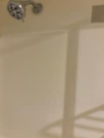 Dirt on shower walls.
