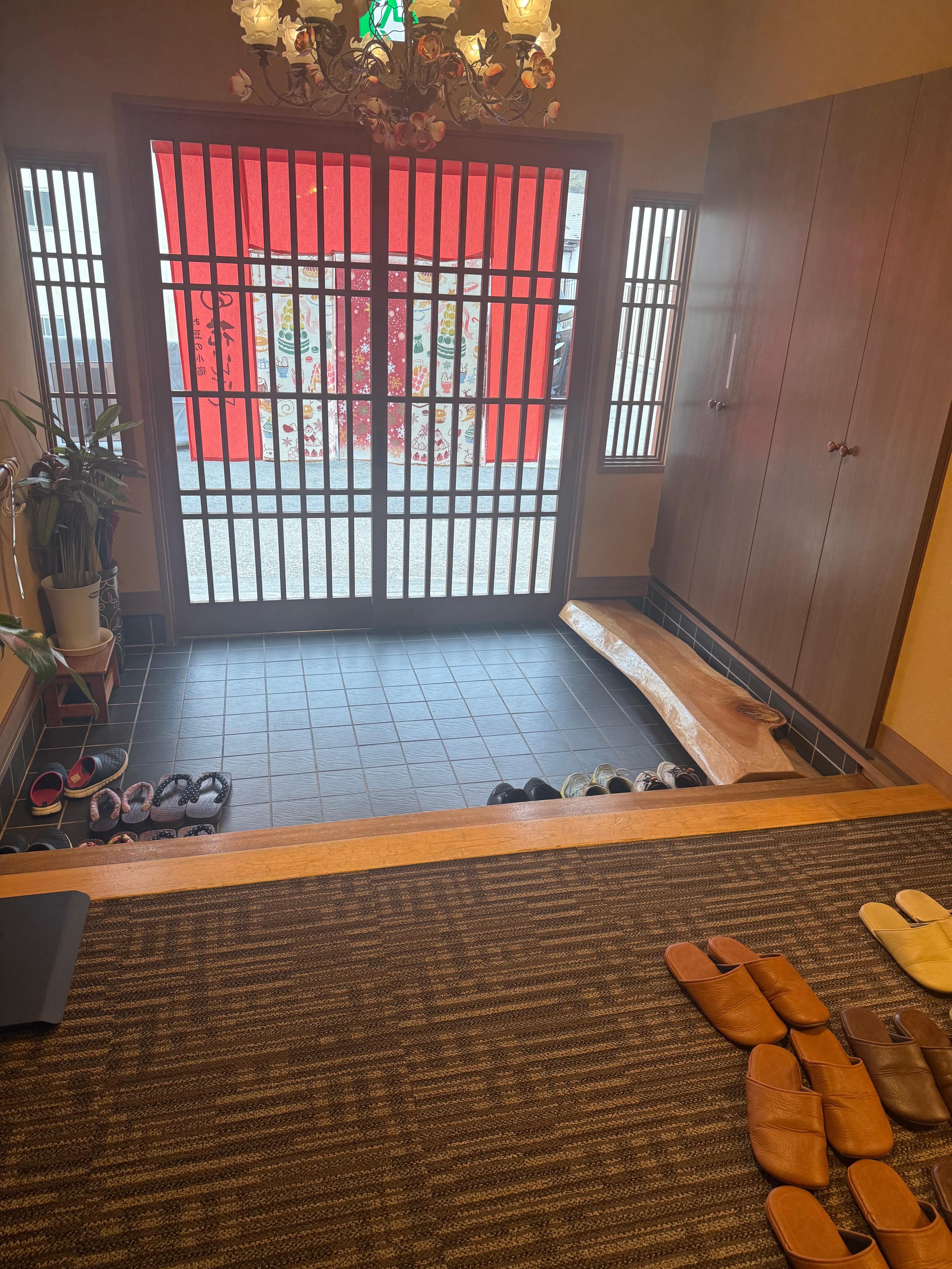 Entryway where you remove your shoes and change into slippers provided