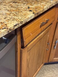 This drawer I’m afraid to pull it out. It looks like it’s hanging there on a string.