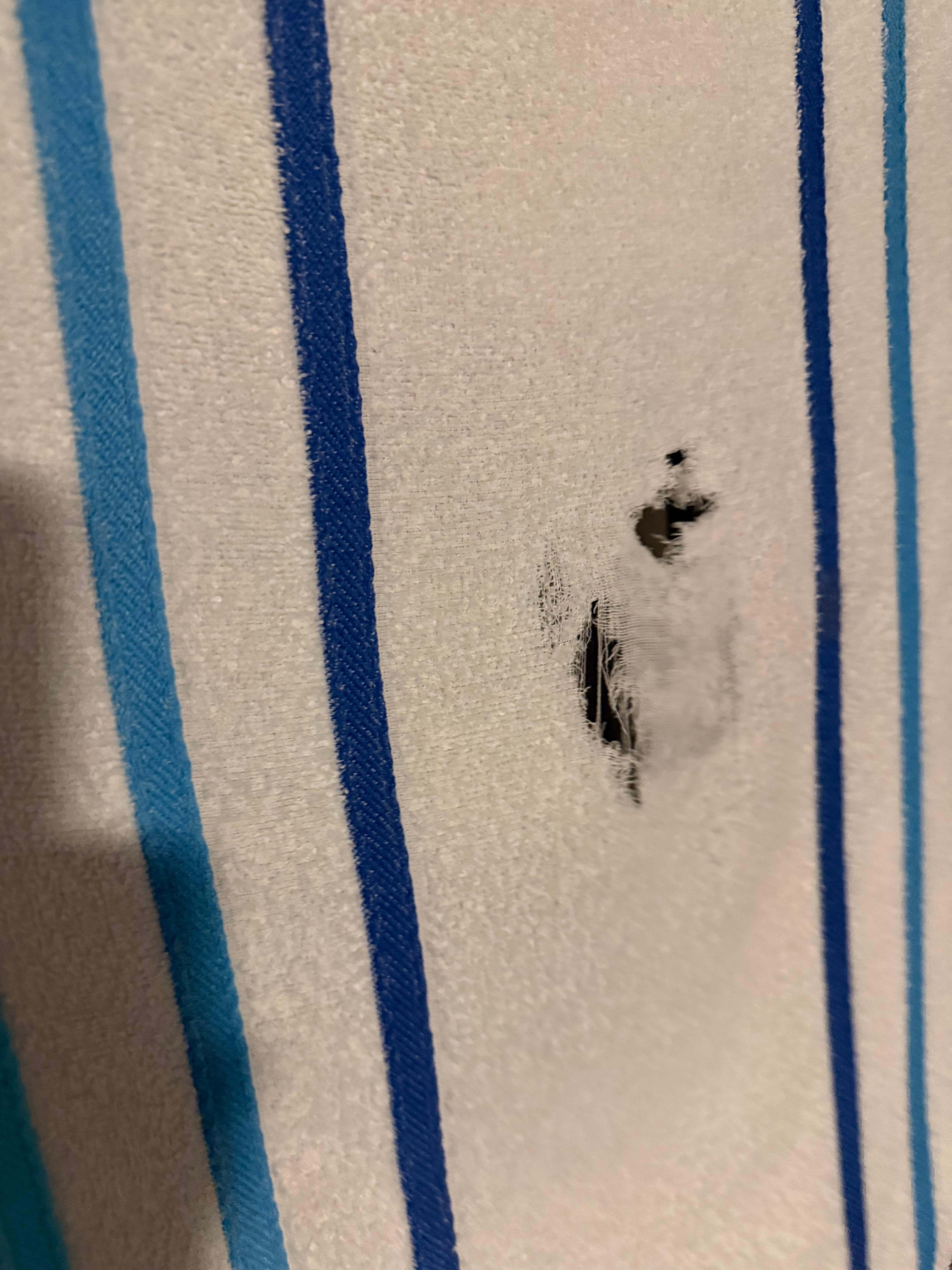 Holes left in towels upon arrival 