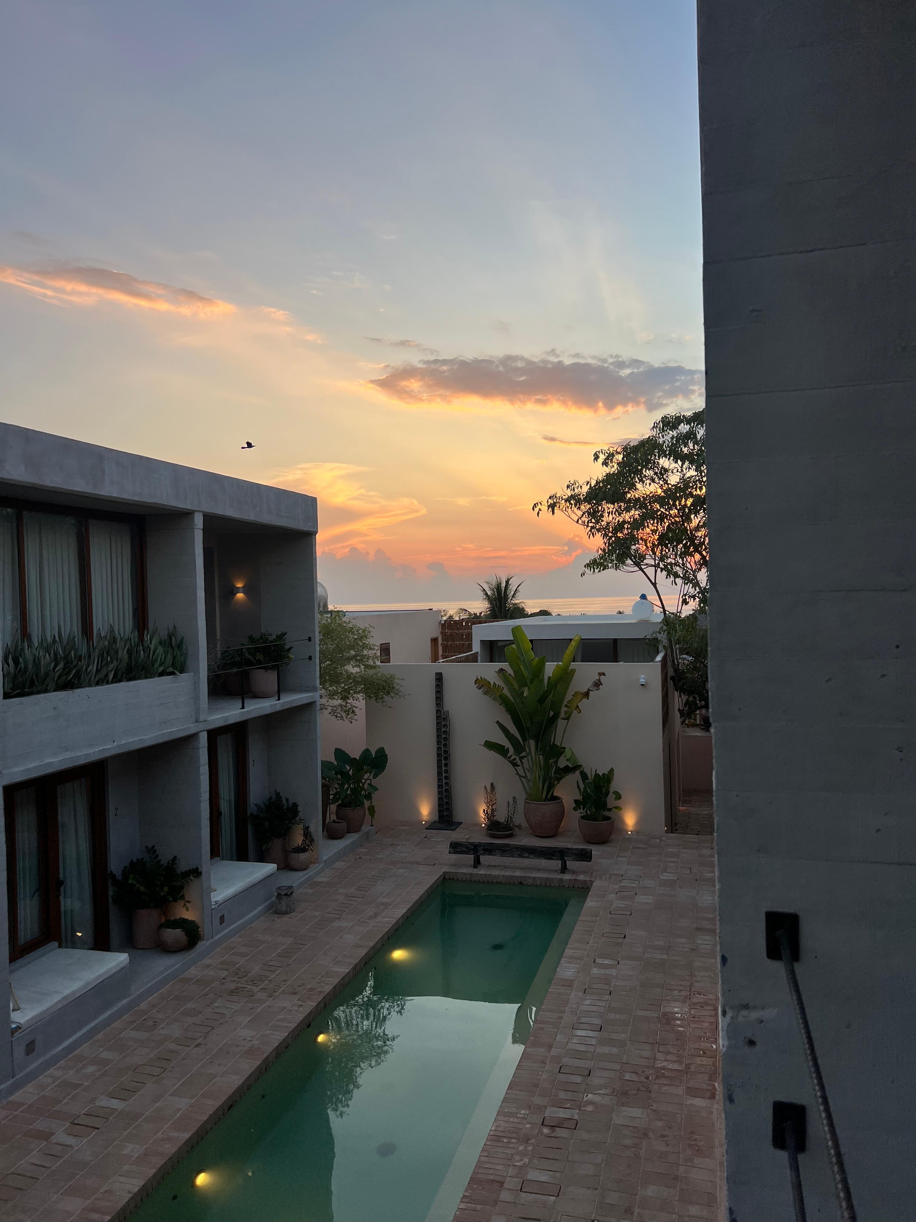 Pool and view of the ocean n far distance. 