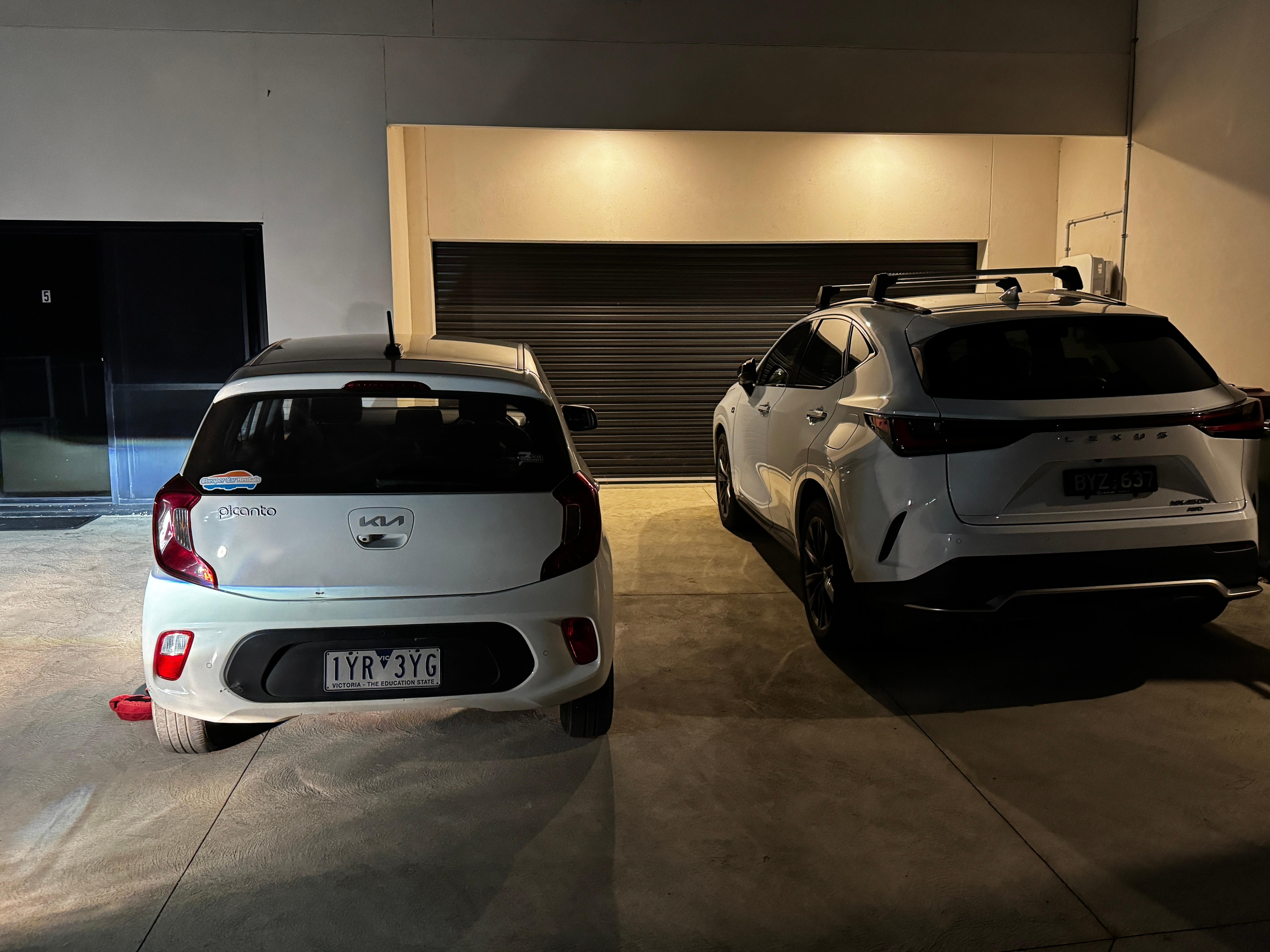 Cars parked not in the parking spaces blocking access