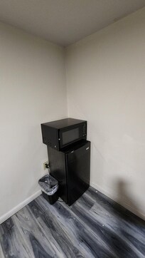 Your marked up kitchen appliances. Note the patched and filthy walls and floor.