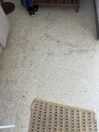 Scuffed and worn bedroom floor