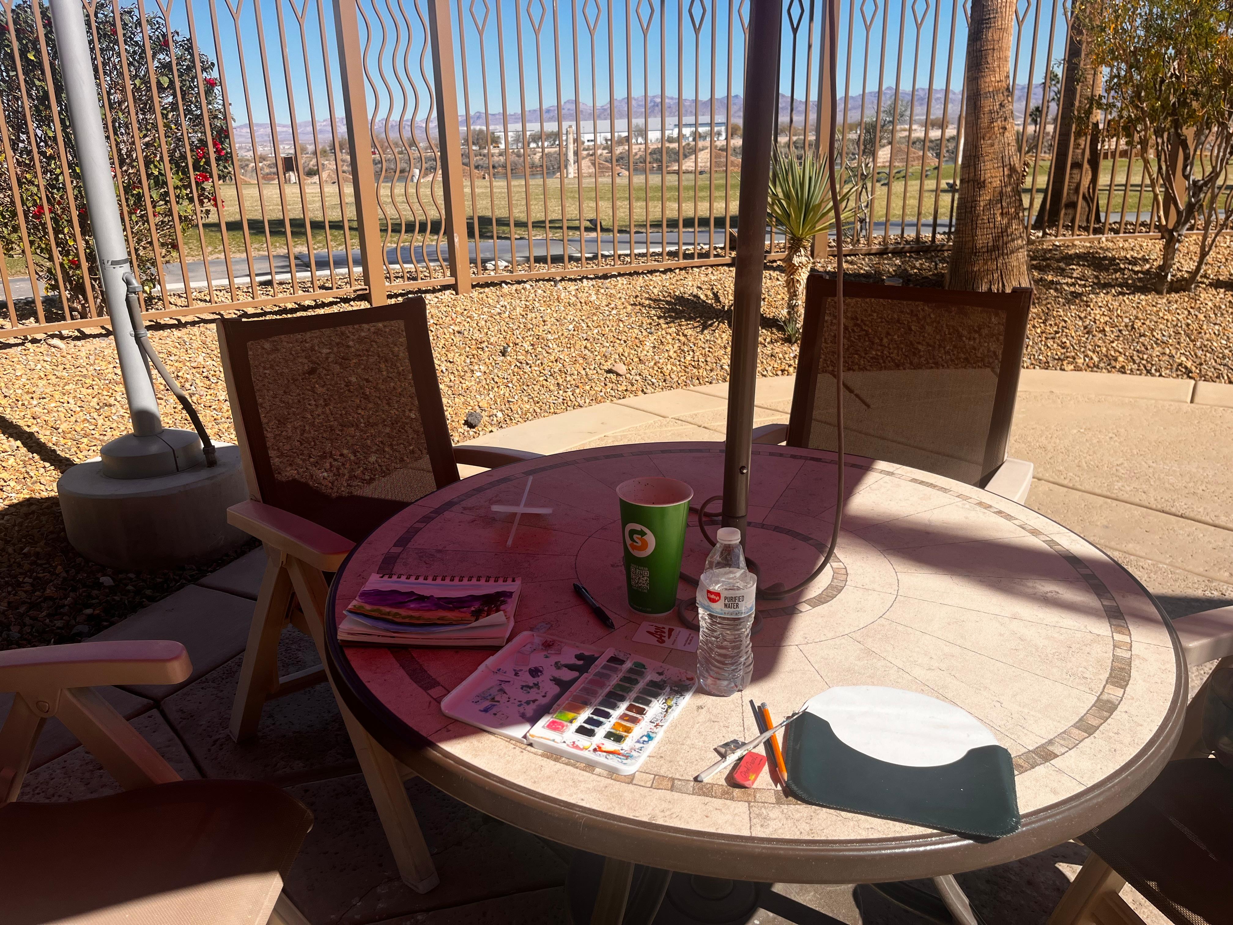 Table by the pool to paint from, with awesome view