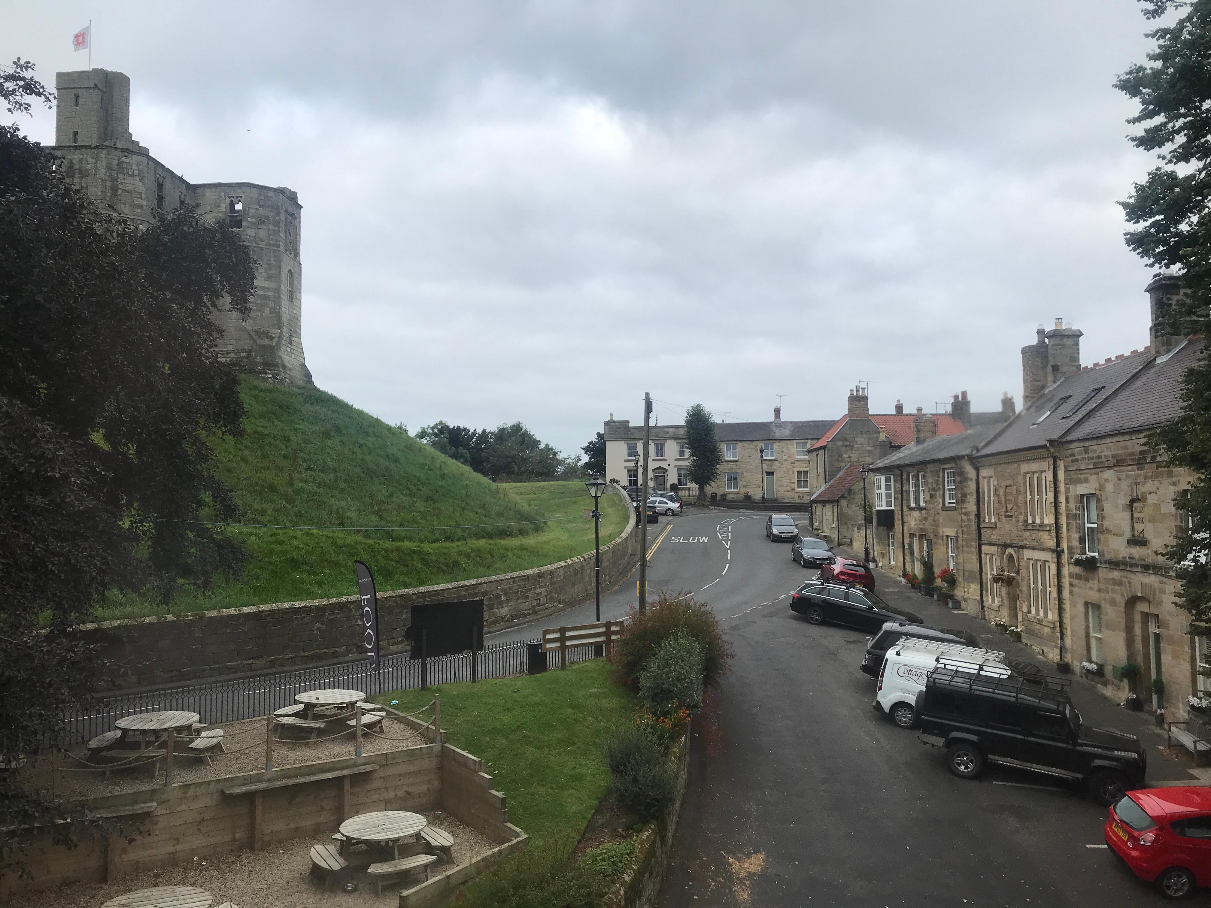 View from the room of castle, road, houses and pub terrace