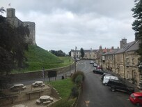 View from the room of castle, road, houses and pub terrace