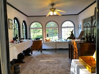 Tables full of fruits, muffins, breads, and drink variety for brkfast.