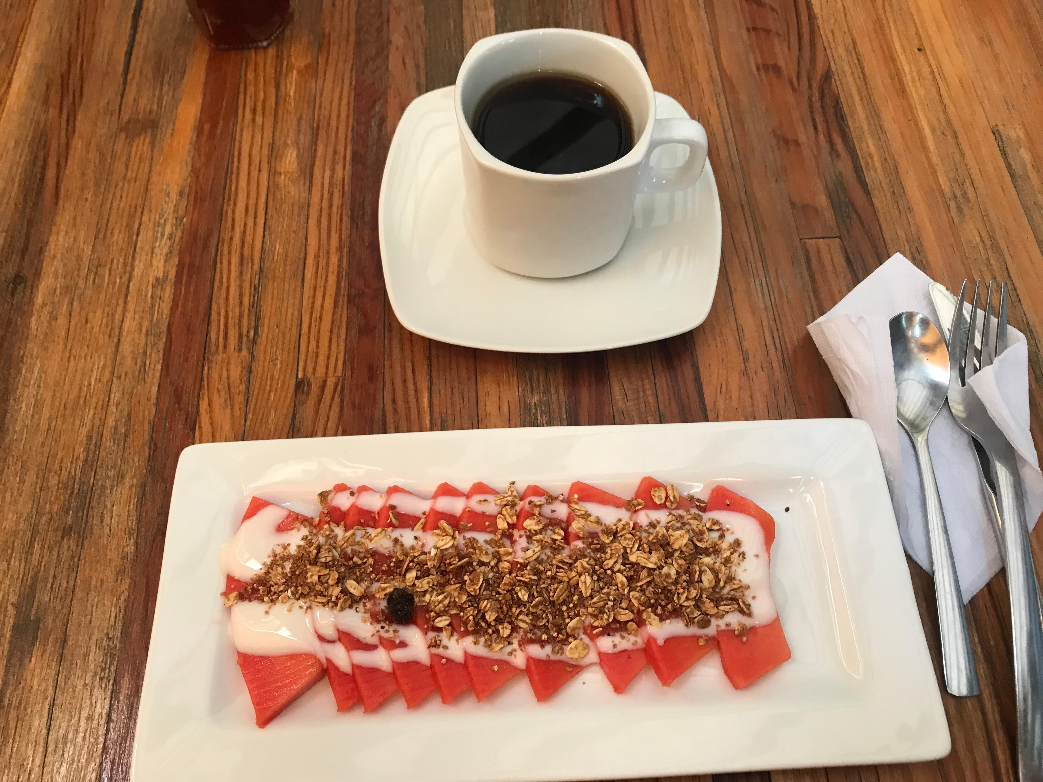 Breakfast with fresh papaya, yogurt and granola