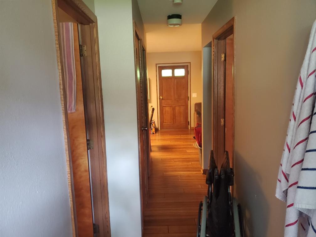 The hallway from the front (red) door to the kitchen/front room 