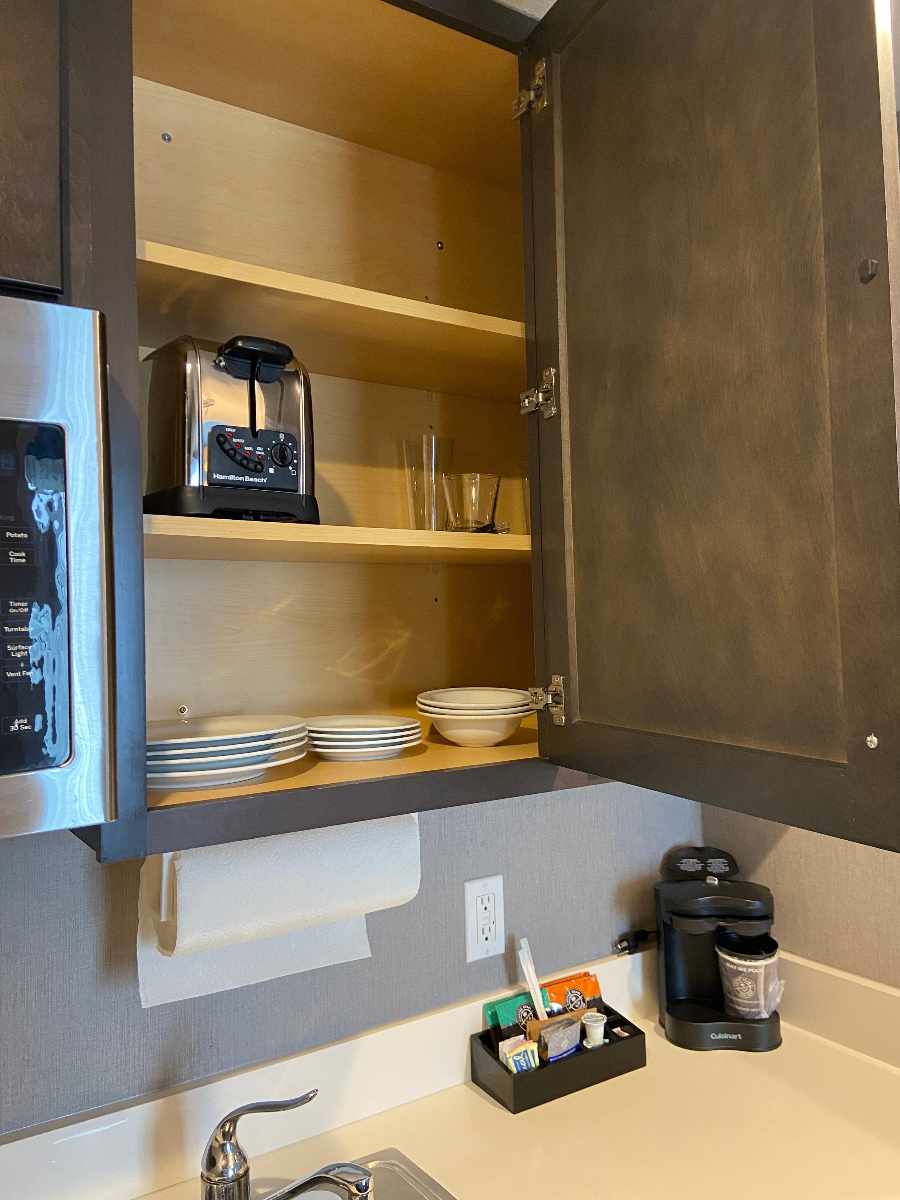 Look inside one of the kitchen cabinets