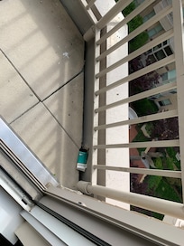 Cigarette packs and cigarette butts on the balcony