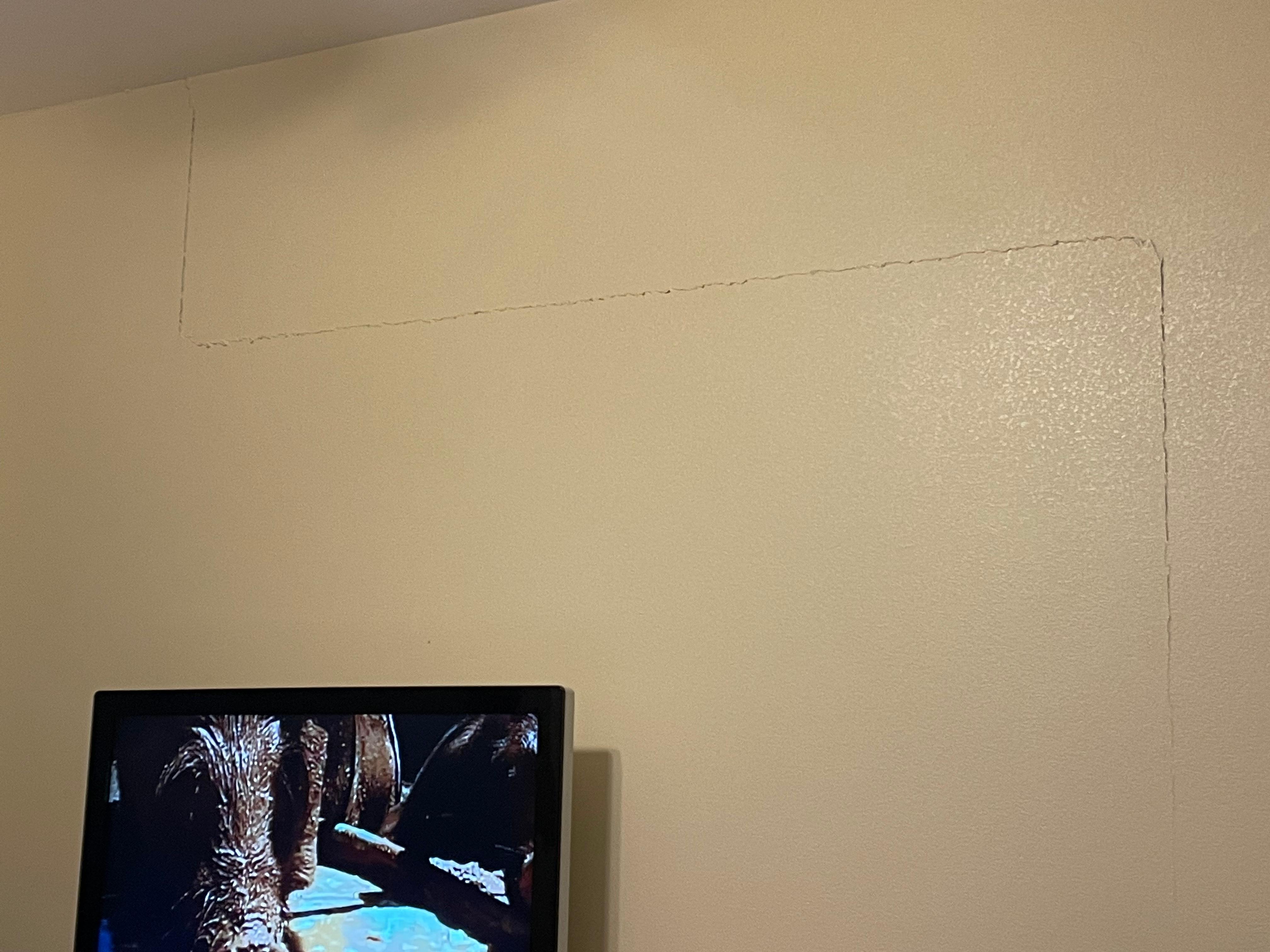 Big long crack in wall from floor to ceiling