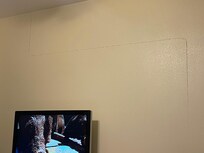 Big long crack in wall from floor to ceiling