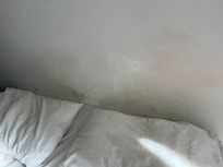 No bed headboard. Wall dirty