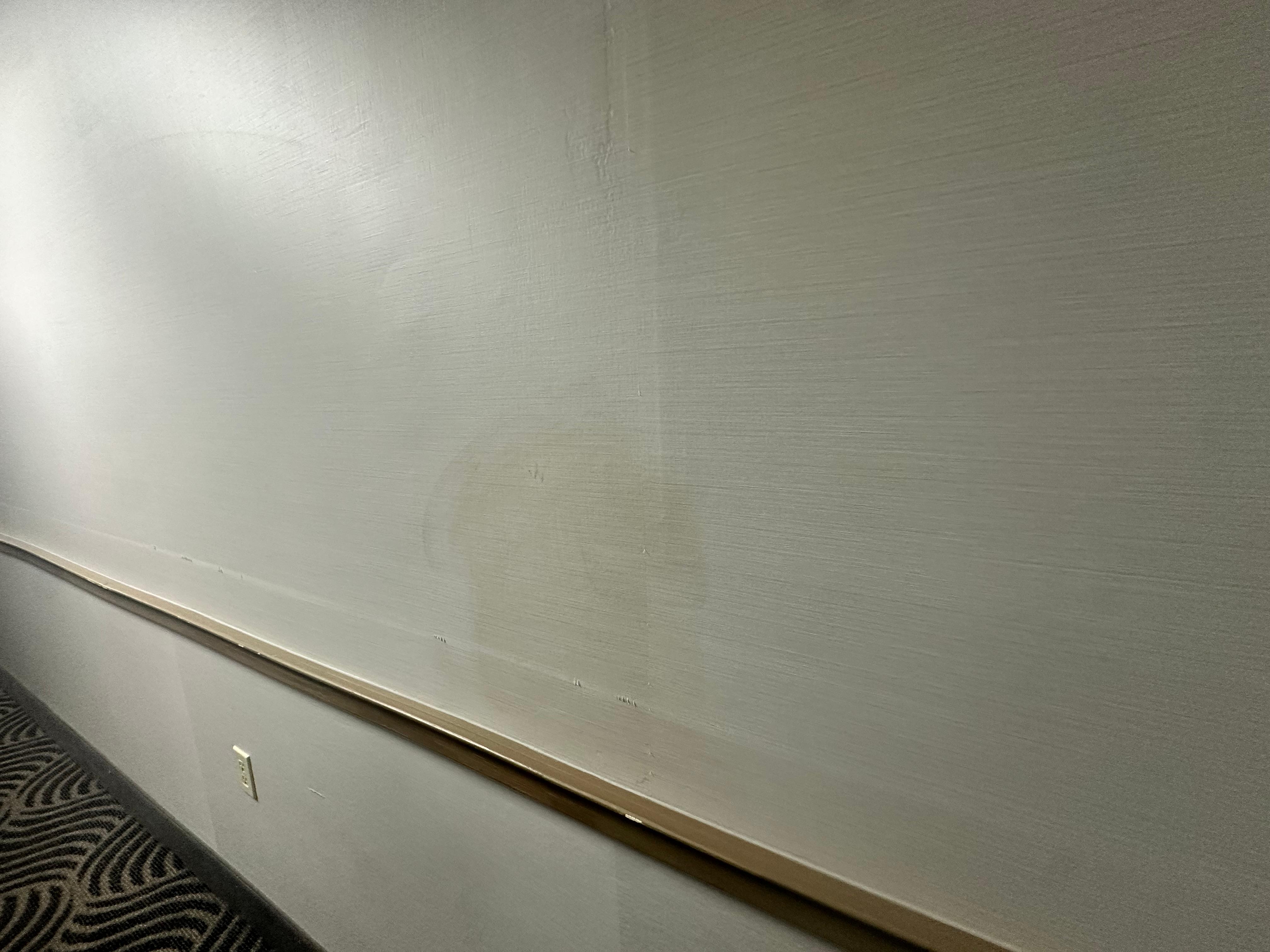 Stains throughout hotel rooms and corridors