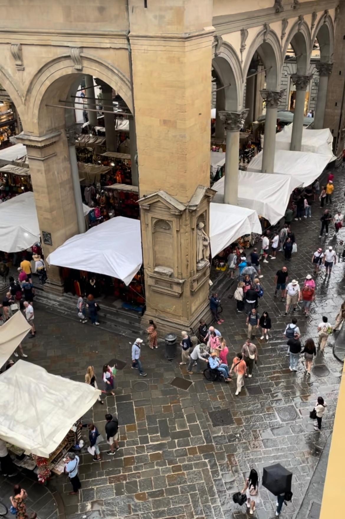 View from our room- opposite direction- right next to market. 