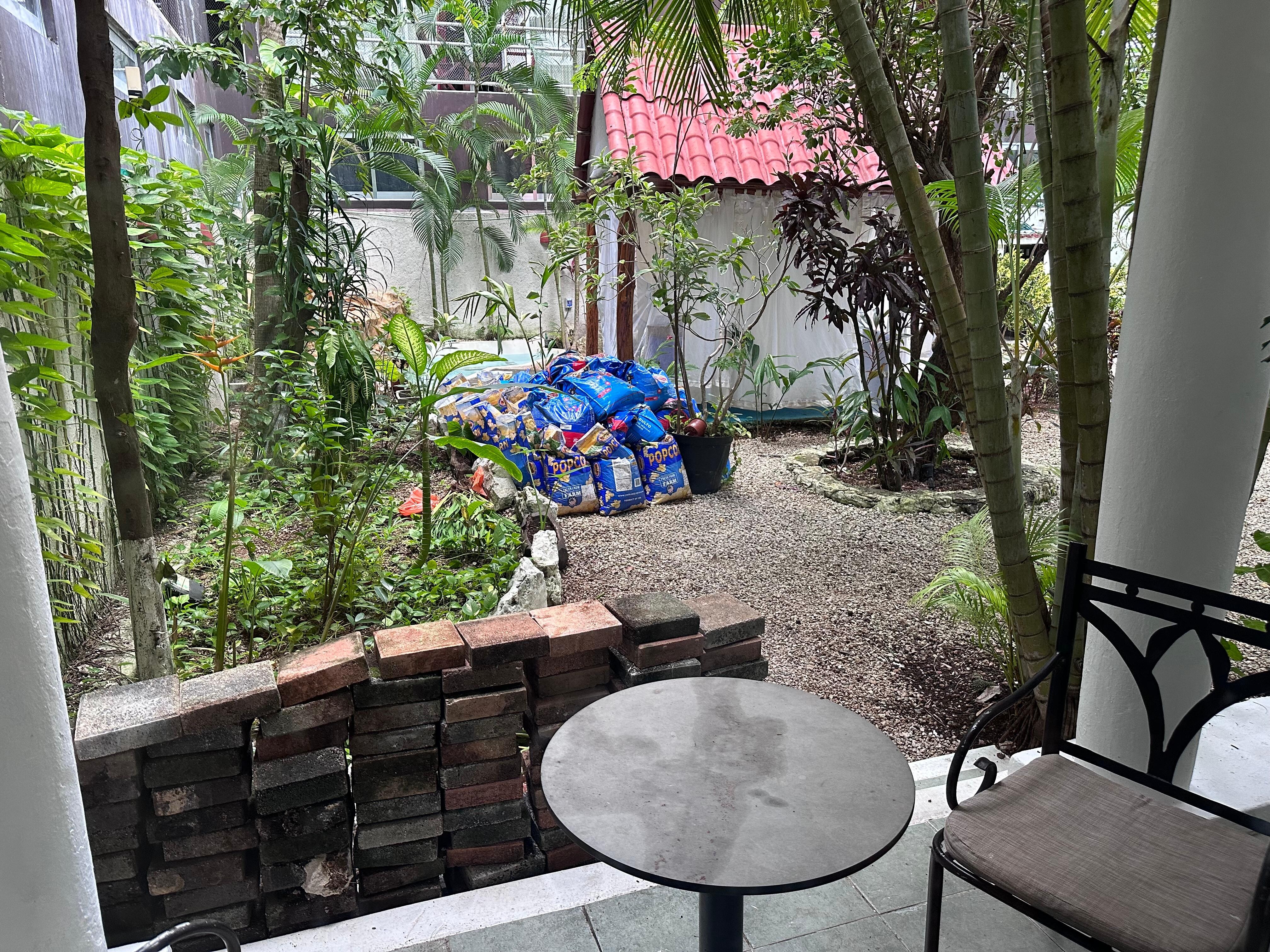 Bags full of gravel and stone wall for project left untouched entire stay.