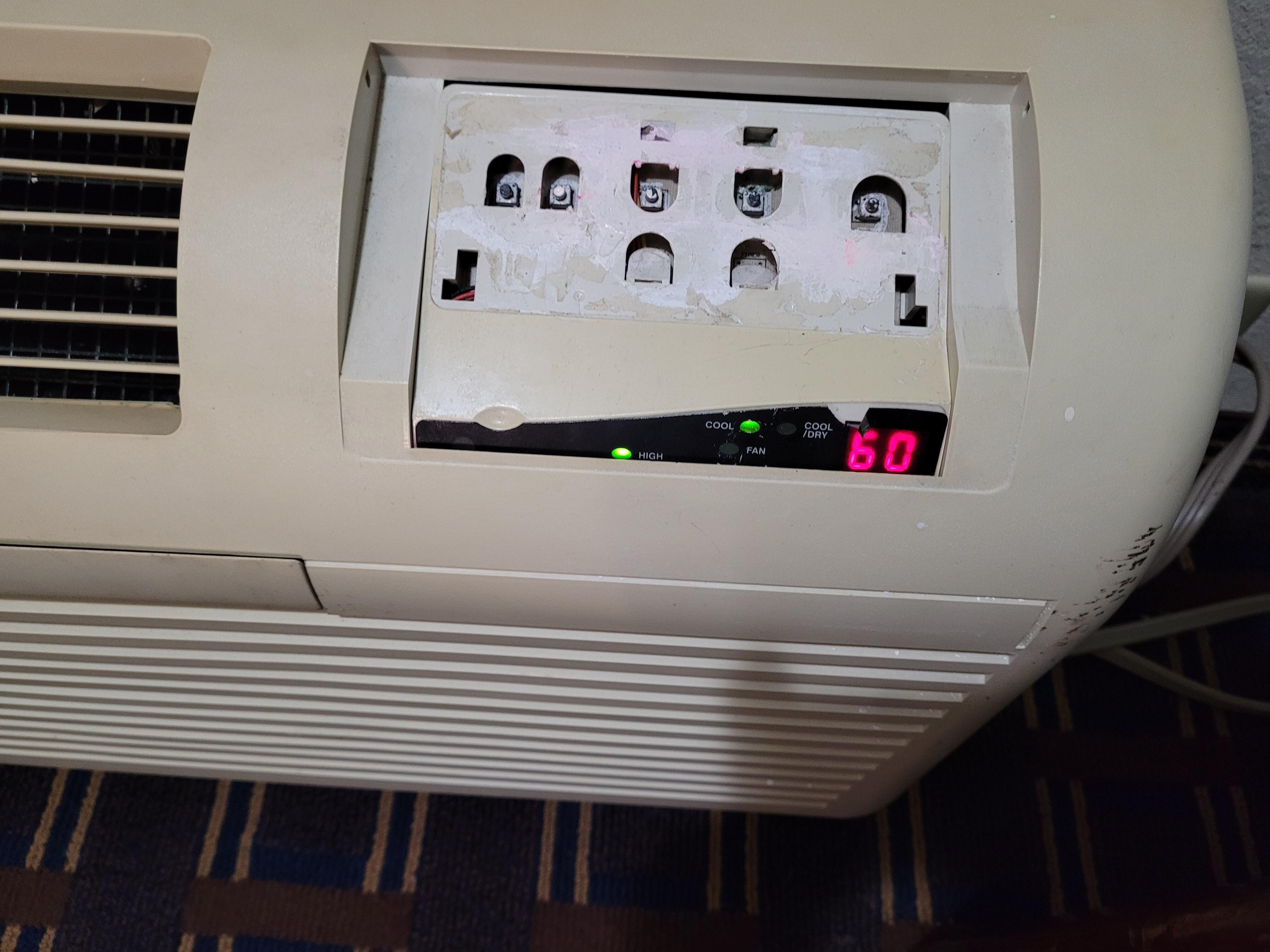 Broken air conditioner control panel. 