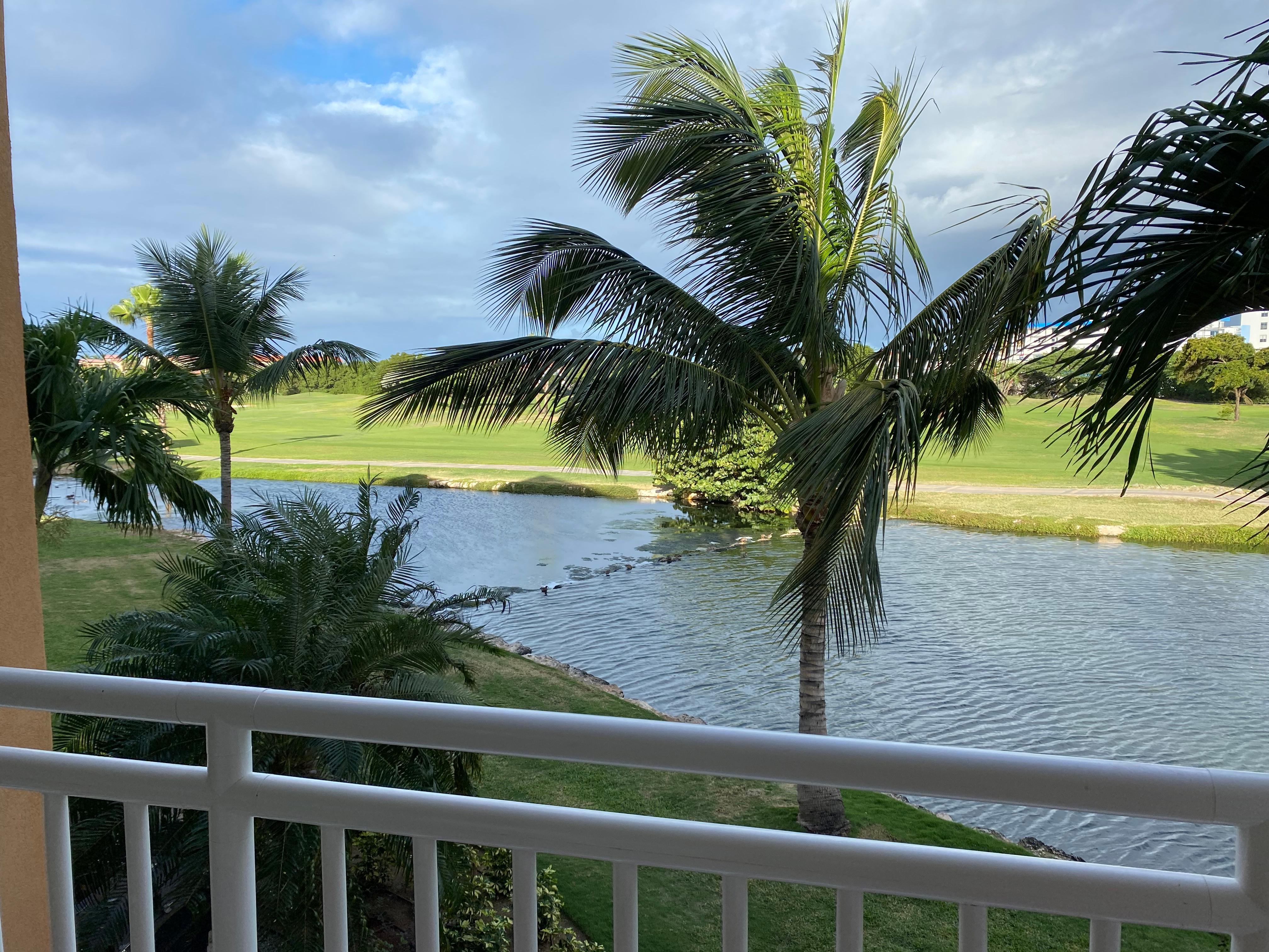 Balcony view overlooking golf course.