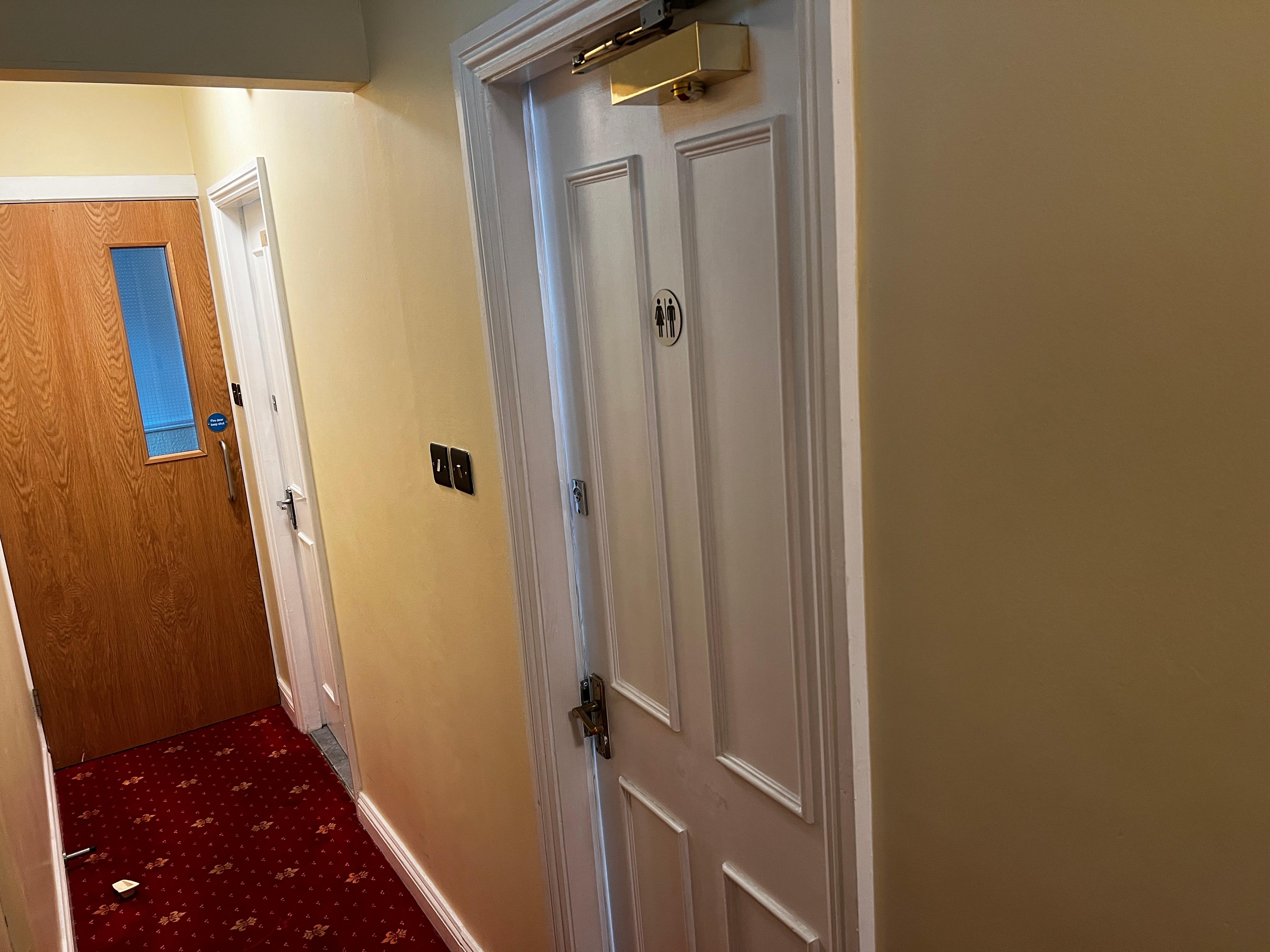 Hallway of the toilet and shower room next to each other