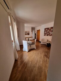 Livingroom from bedroom towards bath and kitchen. Very good and spacious.