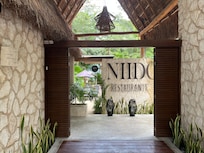 The front of the hotel with the restaurant name.