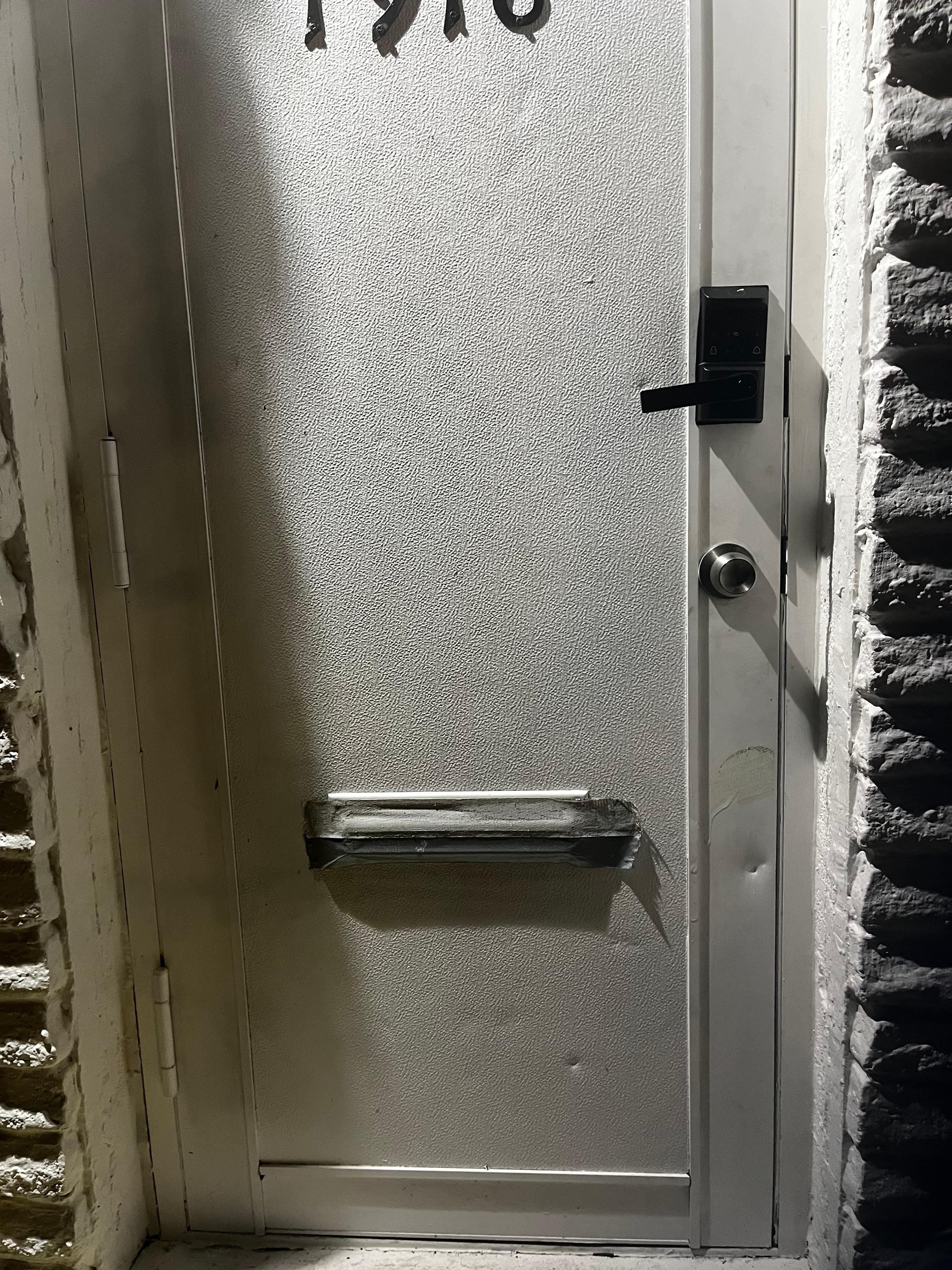 Look at the masking tape on the slot in the door. 