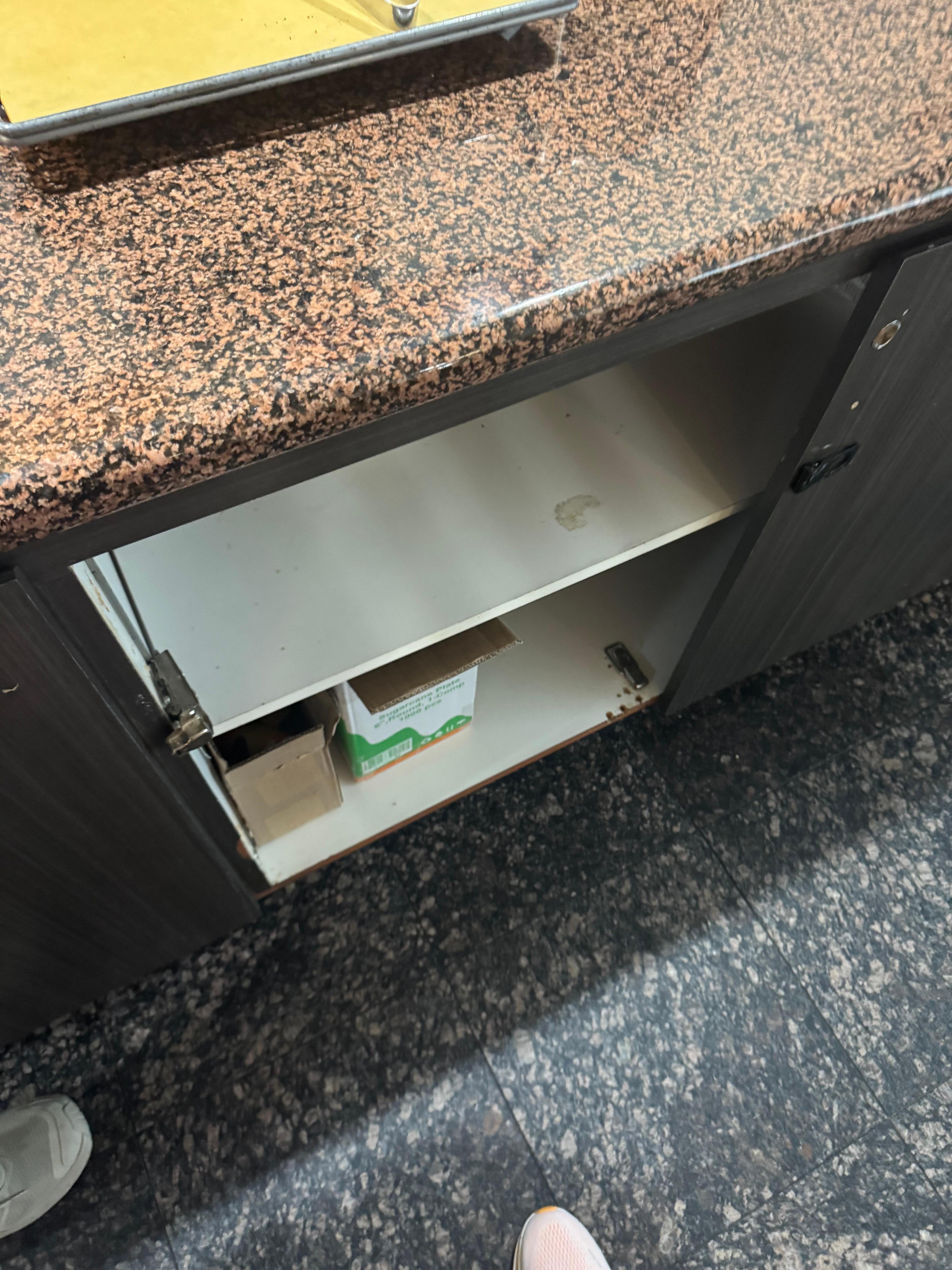 Broken cupboards in breakfast area 